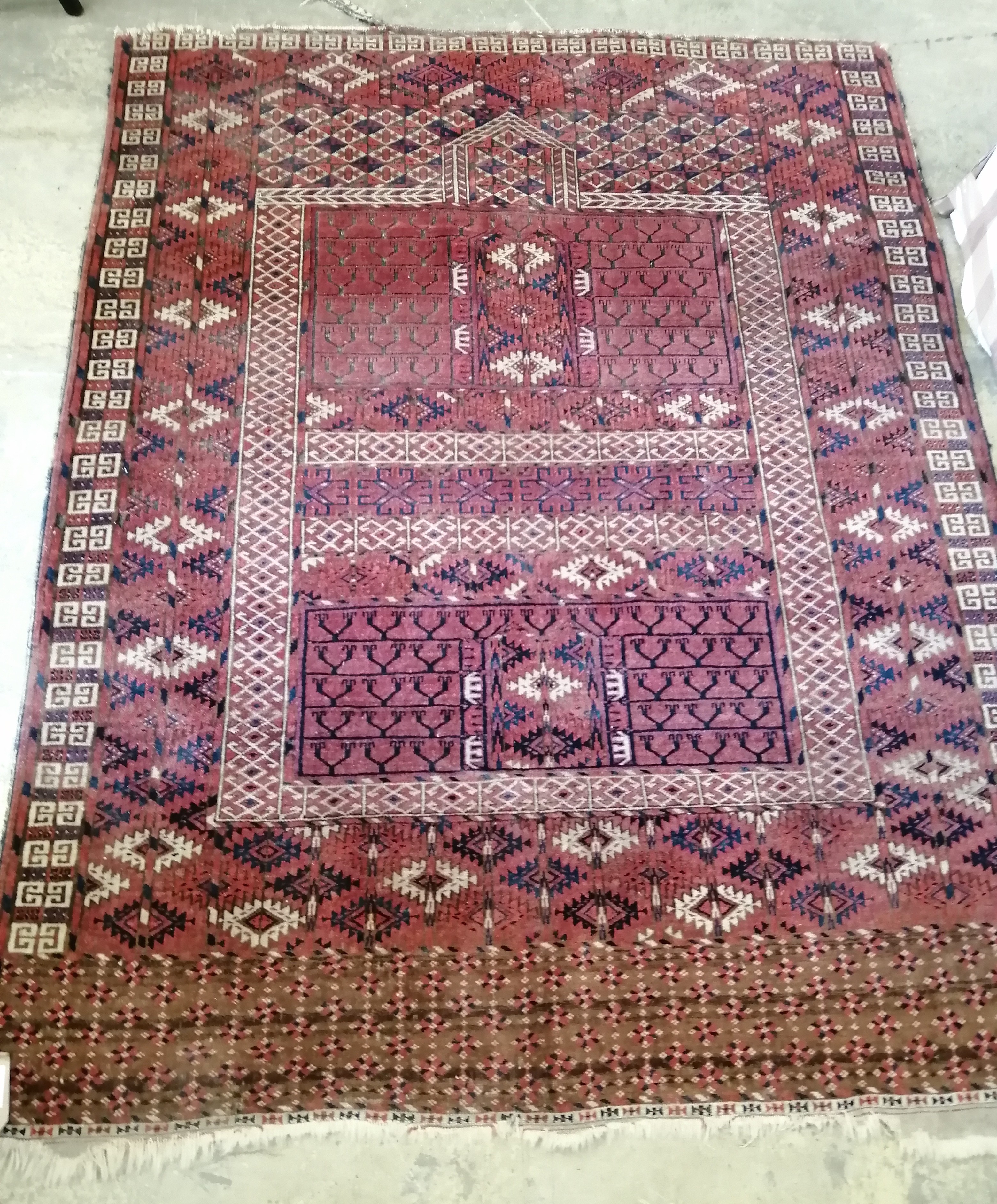A Tekke red ground rug, 168 x 132cm